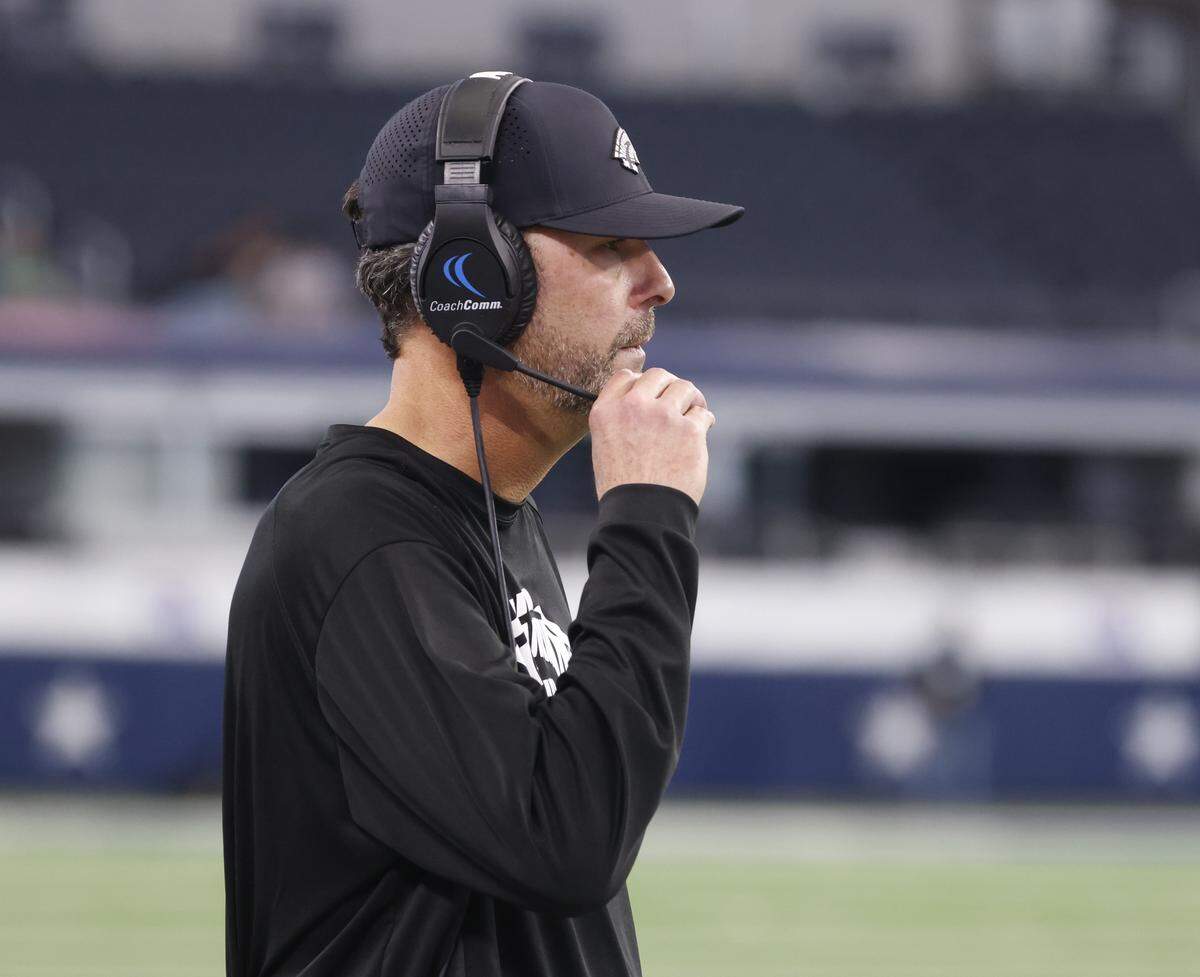 Grandview head coach Ryan Ebner adjusts his headset against Yoakum during the first half of a UIL Class 3A Division I championship game on Thursday Dec. 18, 2025 at AT&T Stadium in Arlington, Texas.