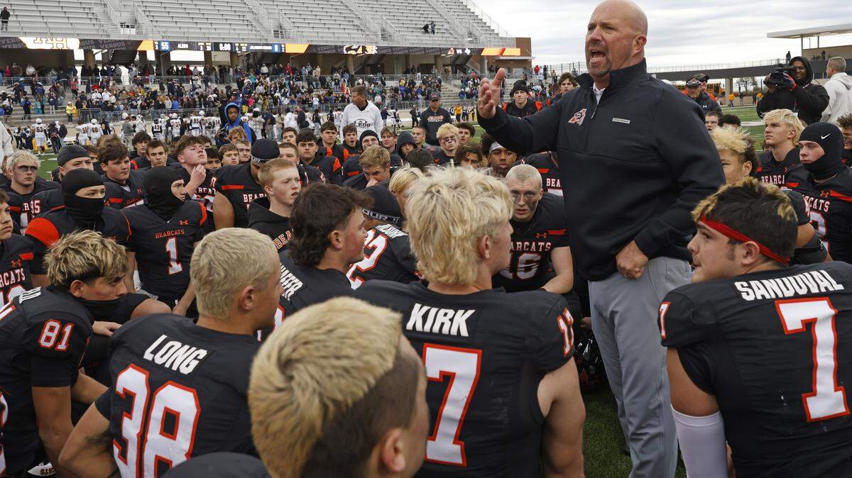 Aledo head coach Robby Jones talks to the team about the road ahead after defeating Fort Worth Arlington Heights in a Class 5A Division I regional playoff Nov. 28 at Crowley ISD Stadium.