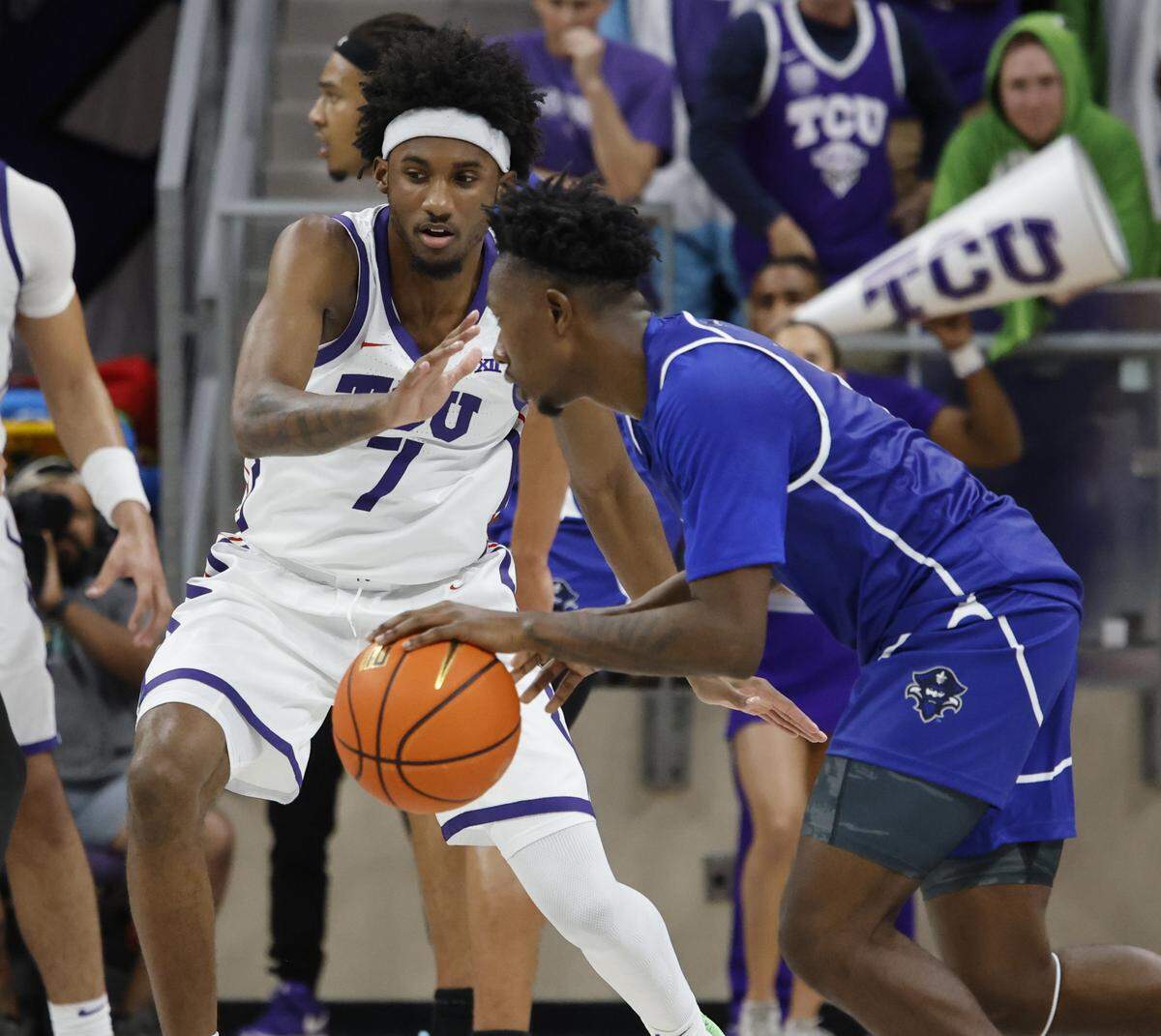 New Orleans guard Jakevion Buckley (5) crosses in front of TCU guard Kayden Edwards (7) during the second half of a NCAA basketball game between New Orleans University and TCU at Schollmaier Arena in Fort Worth, Texas, Monday Nov. 03, 2025. The Horned Frogs dropped their home opener 78-74 to the Privateers.