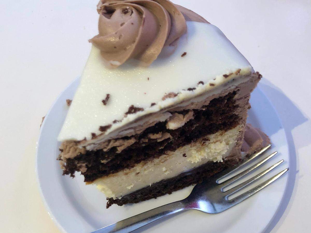 The Metropolitan at Swiss Pastry Shop has a layer of cheesecake between chocolate cake with ganache.