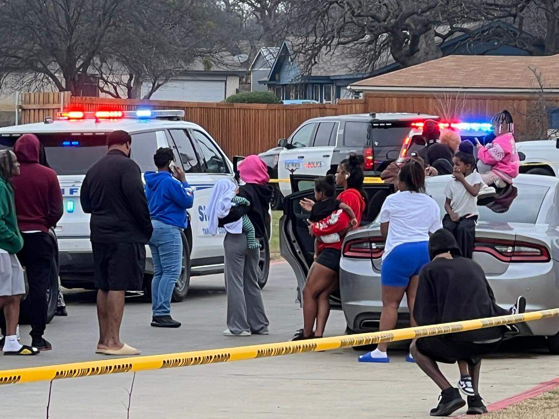 People gather Monday afternoon, March 3, at Slappy’s Car Wash, at 6500 Forest Hill Drive, where ambulances, Forest Hill police officers, Fort Worth police and firefighters, and the Tarrant County Sheriff’s Office responded to a fatal shooting.