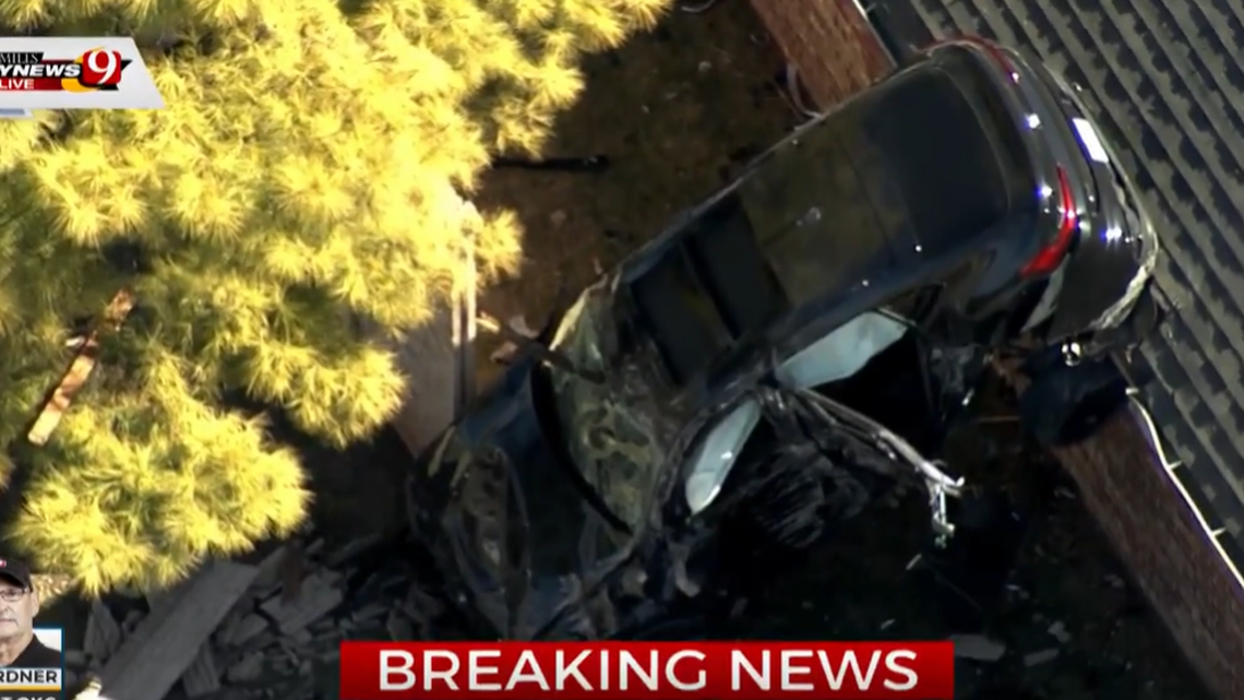 A driver crashed into a home in Oklahoma City, Oklahoma, on Feb. 10, 2022, police said. The sedan landed partially on the roof.