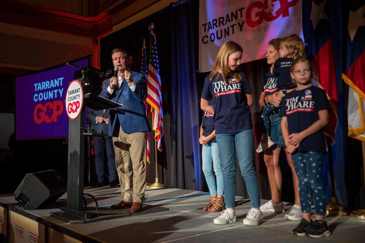 Tim O’Hare speaks at the Tarrant County GOP watch party with his family behind him on Tuesday, Nov. 8, 2022 at the Ashton Depot in Fort Worth. O’Hare currently leads the race for County Judge against Deborah Peoples.