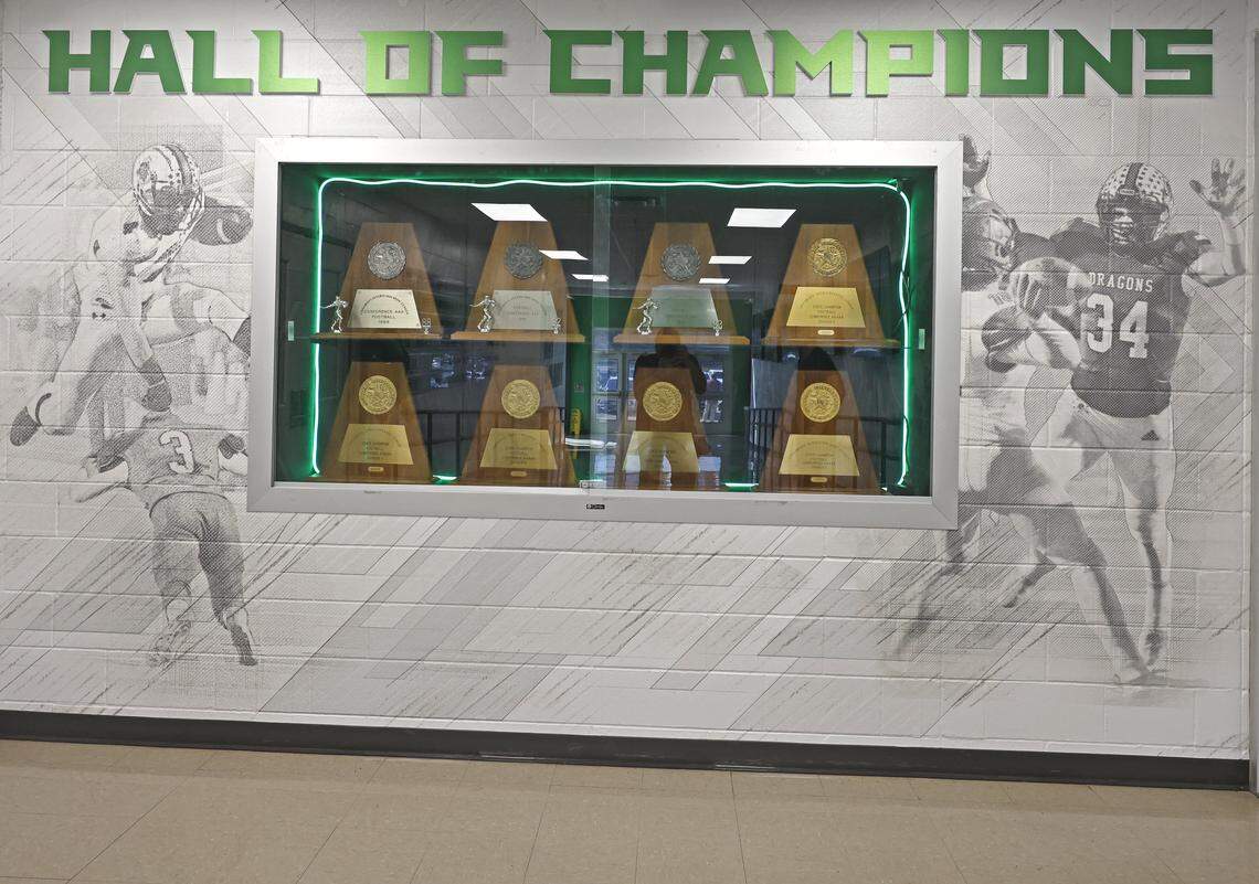 Southlake Carroll’s eight football state championship awards in a glass display