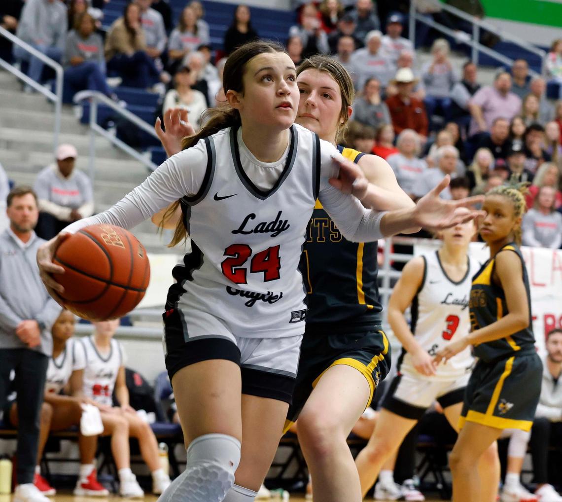 Argyle forward Brooklynn Northeim (24) is fouled on the way to the net during the fourth period of a UIL Conference 5A Region 1 Area Round Championship basketball game at Haslet Eaton High School in Fort Worth, Texas, Friday, Feb. 16, 2024.