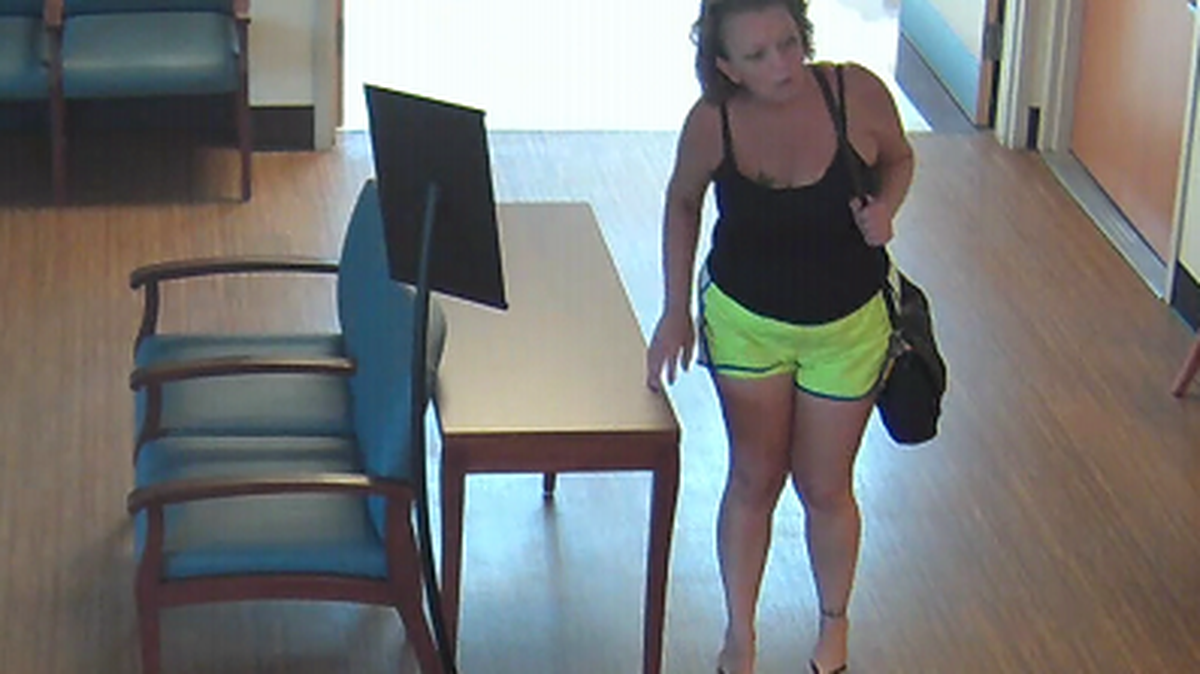 Arlington police released photos of a woman they said walked into USMD Hospital at Arlington and snatched the purse of an employee on September 26.