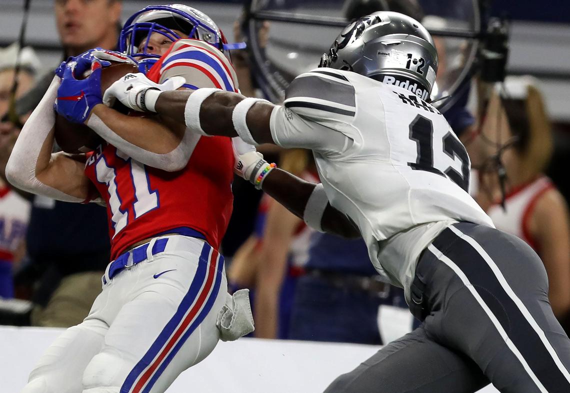 Austin Westlake wide receiver Mason Mangum (11) hauls in a reception against Denton Guyer defensive back Deuce Harmon (12) during the second half of the 6A Division II High School State Football Championship game played at AT&T Stadium in Arlington, TX, Saturday, December 21, 2019.
