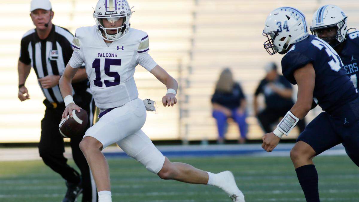 Timber Creek’s Carson Porter escapes the rush of the L.D. Bell defense during their UIL football game Friday night at Pennington Field In Hurst on Friday Sept. 6, 2024.