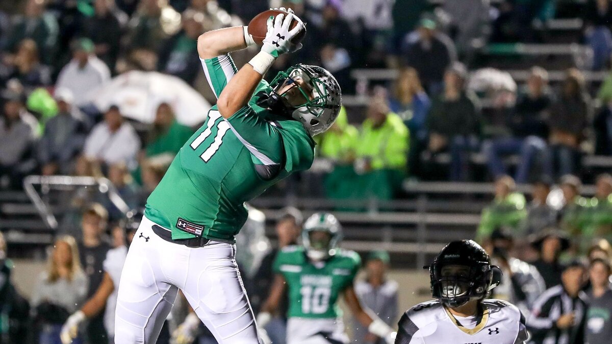 Southlake Carroll wide receiver Blake Smith (11) goes up for a 17 yard touchdown reception against Keller Fossil Ridge during the first half, Friday night, October 19, 2018 played at Dragon Stadium in Southlake, TX.