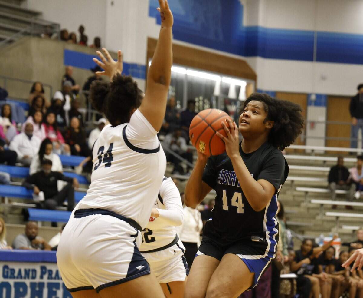 North Crowley forward London Campbell gets a sot off defended by Allen forward Ashley Gatson (34) during the first half of a UIL Class 6A Division I girls regional semifinals basketball playoff game at Grand Prairie High School in Grand Prairie, Texas, Tuesday Feb. 24, 2026.