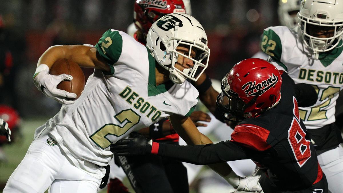 DeSoto’s Cameron Hutchings (2) tries to avoid a tackle by Cedar Hill’s Antwan Reeves (87) during a high school football game at Longhorn Stadium in Cedar Hill, Texas, Thursday, Nov. 7, 2019.