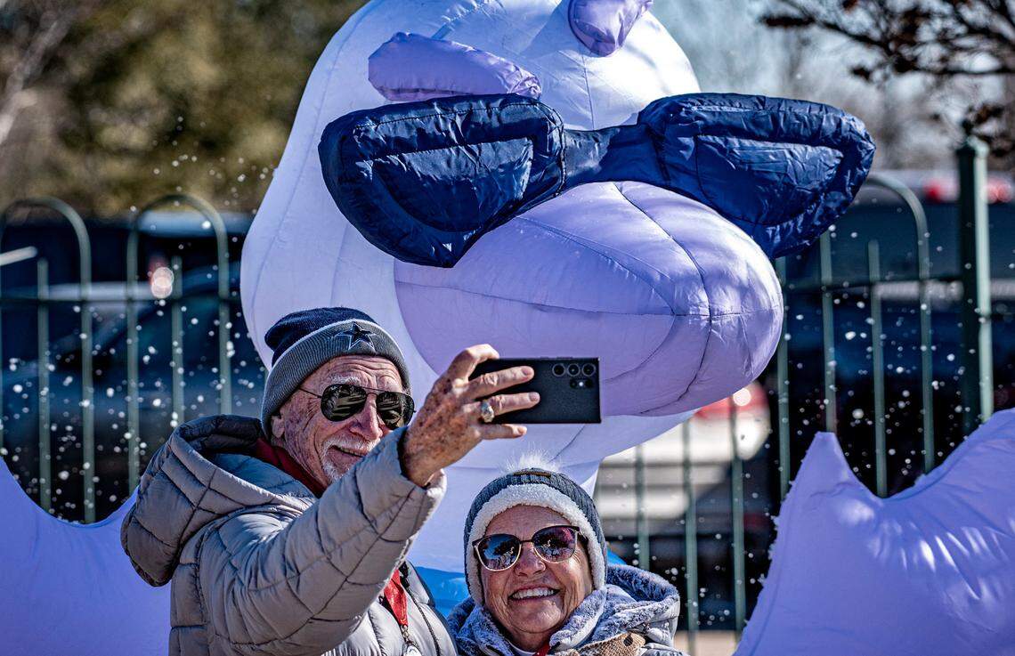 Ken and Sharon Sapp take a selfie in front of an inflated goose before heading to the beach to watch the Goosebump Jump Saturday, Jan. 20, 2024. The Sapps said they “moved up” to Granbury five years ago from North Richland Hills. Were either of them jumping in the lake? “Absolutely not,” Ken said.