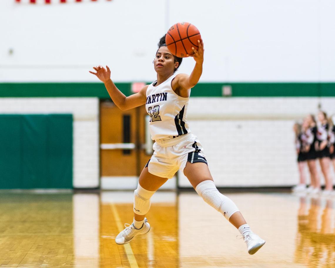 Martin Jr. Autumn Smith (12) reaches out to catch a wide pass during the 1st half of the Bi-District game between Arlington Martin and Trinity at Arlington High on February 18, 2020 (Matt Smith/Special to the ST)