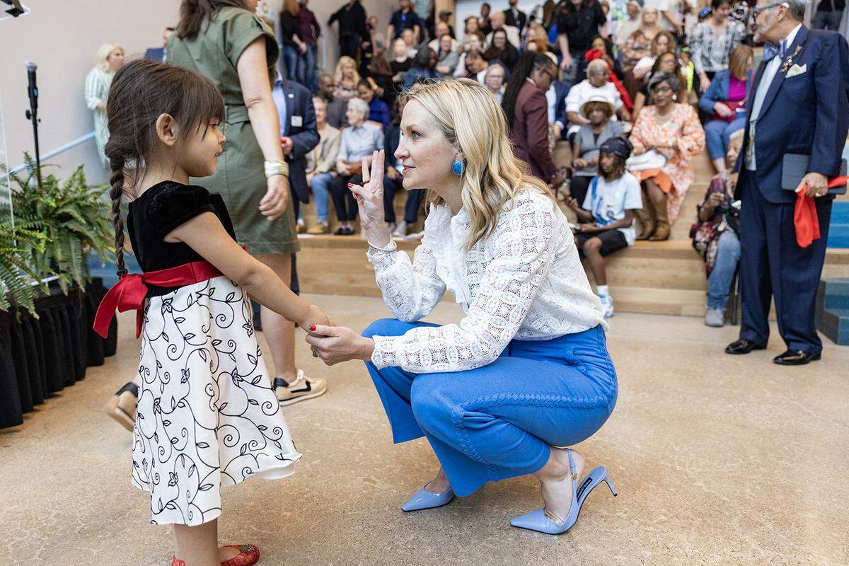 Maddison Ledesma, 4, meets Fort Worth Mayor Mattie Parker following the grand opening ceremony of the brand new Riverside Campus in the Morningside neighborhood of Fort Worth on Friday, May 2, 2025. 