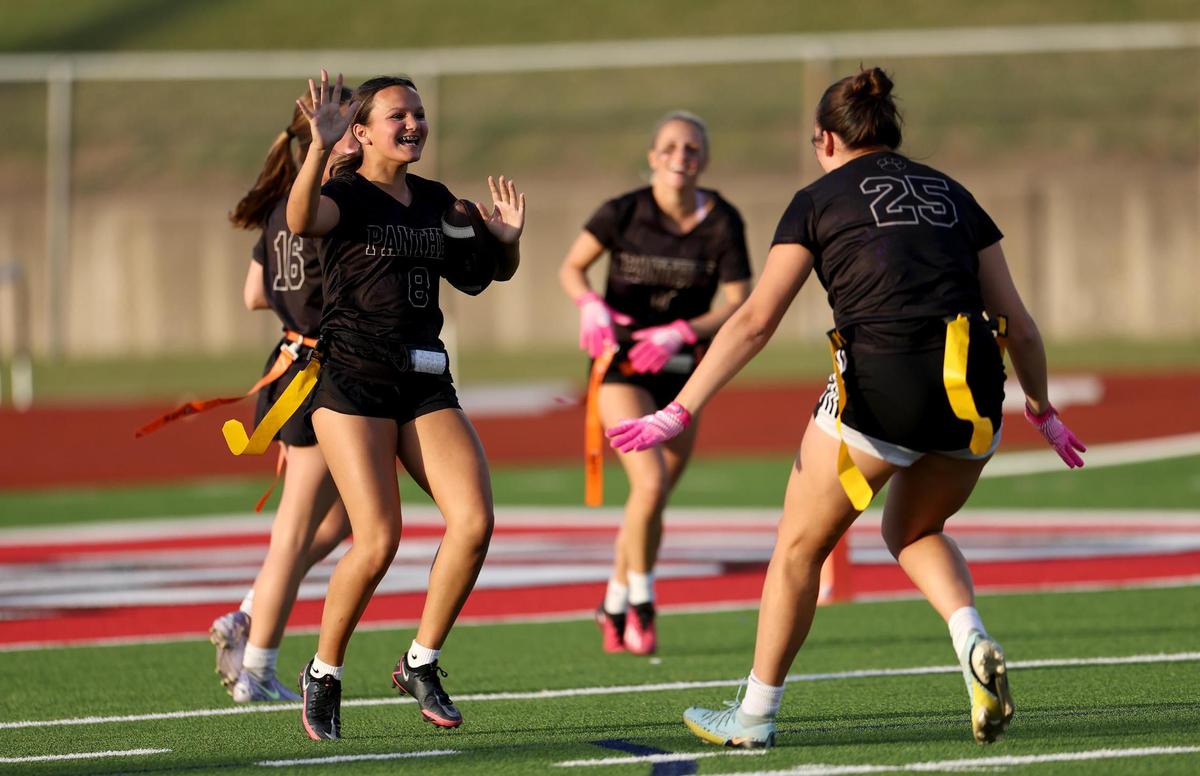 The Paschal Panthers celebrate a touchdown by Caroline Herron (8) during the first half of the FWISD flag football championship on Tuesday, May 13, 2025.