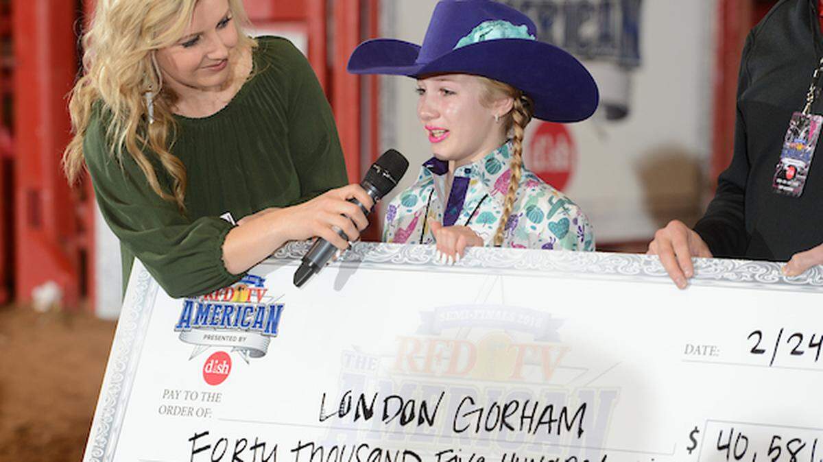 London Gorham, a 10-year-old barrel racer from Cotulla, is presented with her check for $40,586 after winning Saturday's semifinals of RFD-TV's The American at at Fort Worth’s Cowtown Coliseum. Gorham now has a shot at more than $1 million in Sunday's finals at AT&T Stadium.