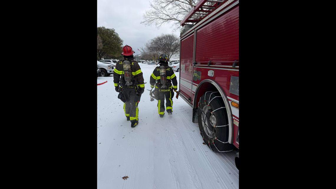 Lewisville, Texas firefighters work during the January 2026 snow storm.