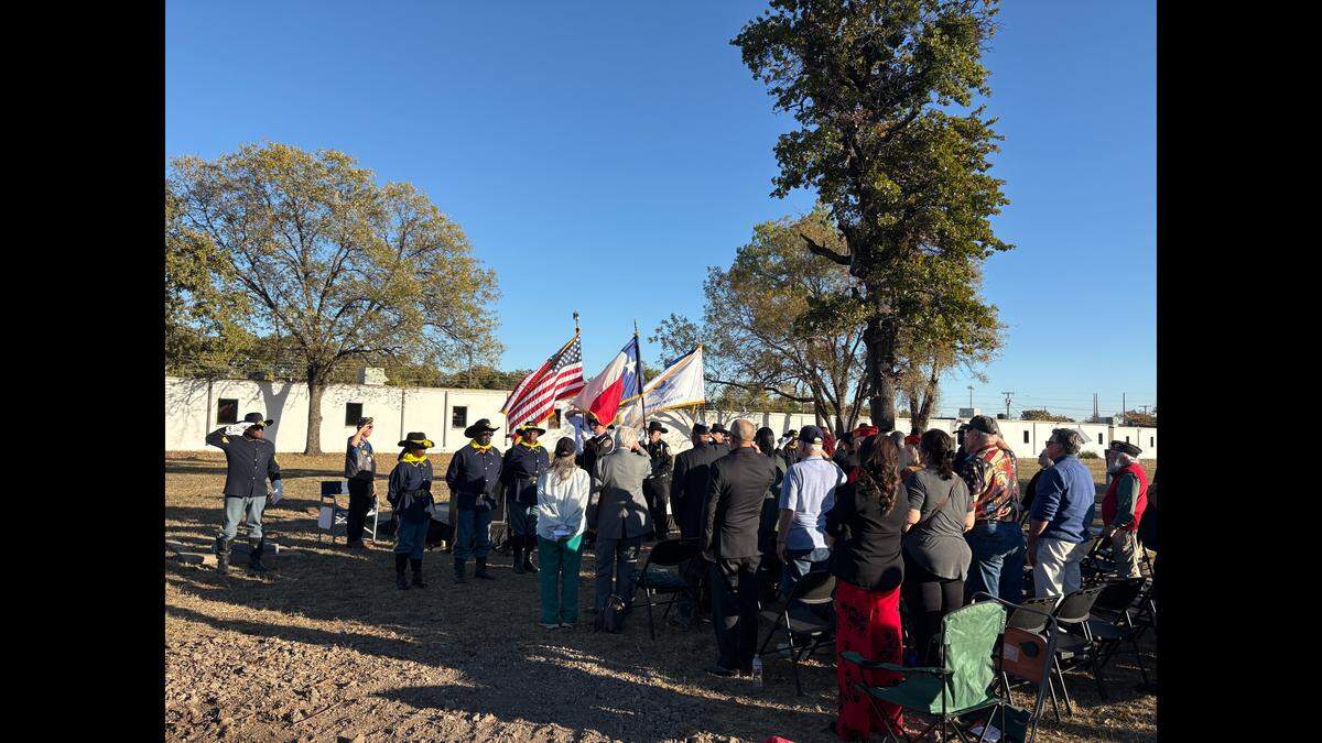 The Tarrant County Sheriff’s Office’s honor guard detail presents the colors during a ceremony at New Trinity Cemetery in Haltom City on Tuesday, Nov. 11.