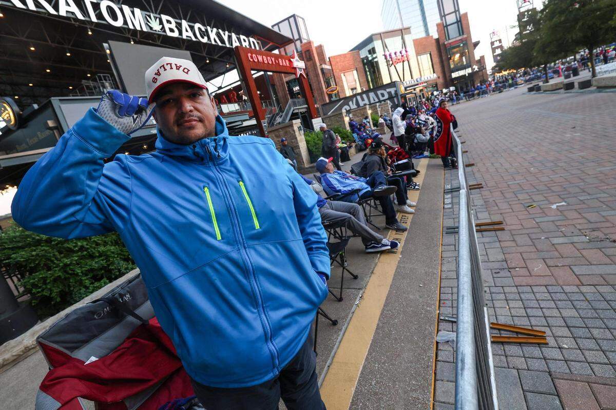 Dallas resident Abraham Robles grabbed his spot near tbe celebration stage outside of the Texas Live! at 1:30 a.m. Friday.