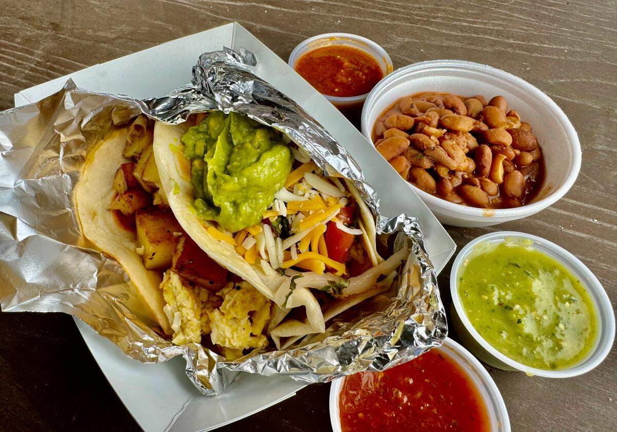 Breakfast tacos with the complimentary beans and salsas at DelNorte Tacos in the Johnson County town of Godley, August 11, 2024.