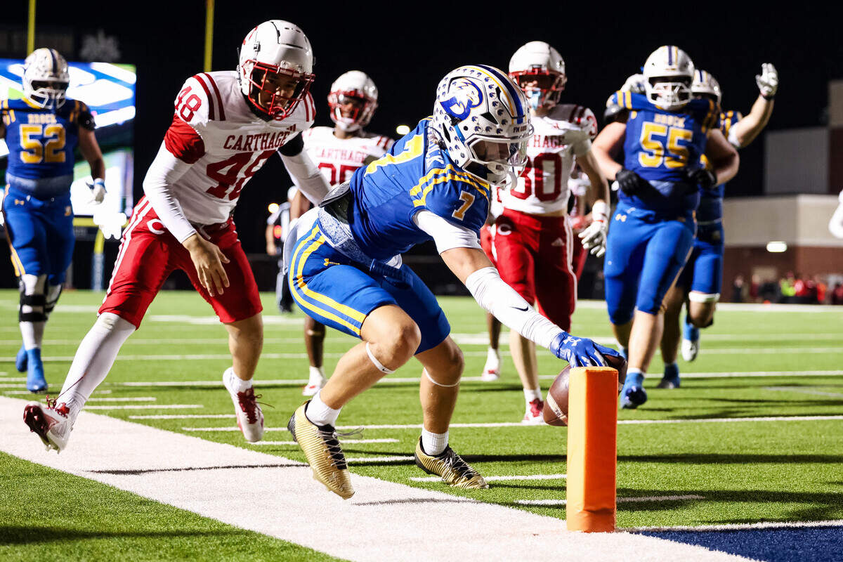 Brock wide receiver Colt Matlock dives for the pylon in the corner of the end zone in a Class 4A Division II state semifinal against Carthage on Friday at Memorial Stadium in Mesquite.