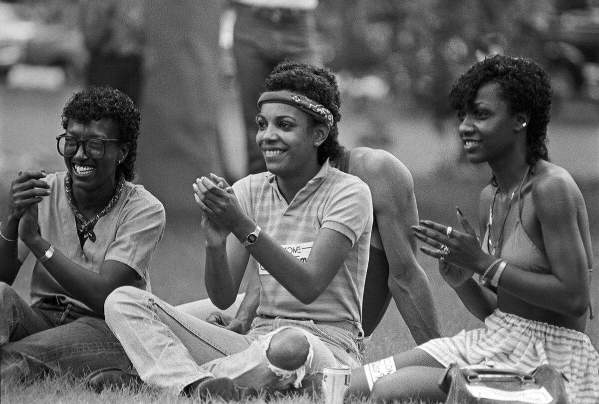 Teresa Blackburn, left, Dee Cooper and Sharon Bell, clap their hands to the music during the 1983 Juneteenth Blues Festival at Sycamore Park in Fort Worth. The concert, which featured Chicago bluesman Byther “Smitty” Smith, was the first of a weekend-long series of events for Juneteenth.