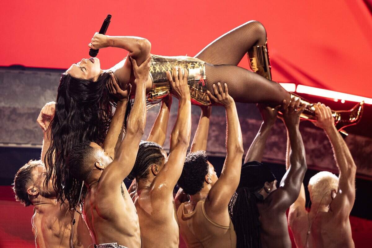 Dua Lipa performs on stage for her Radical Optimism Tour at American Airlines Center in Dallas on Tuesday, Sept. 30, 2025.