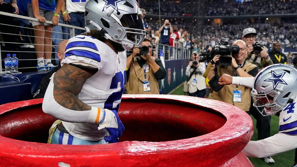 Dallas Cowboys’ Ezekiel Elliott (21) celebrates a touchdown run during the second half of an NFL football game against the Indianapolis Colts, Sunday, Dec. 4, 2022, in Arlington, Texas..