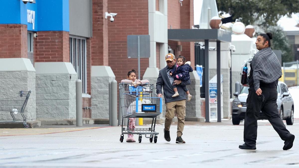 Shopper come and go from a Walmart in Arlington on Friday, Jan. 10, 2025, in Arlington. The winter storm warning in effect for North Texas has been downgraded to a winter weather advisory, according to the National Weather Service Fort Worth.