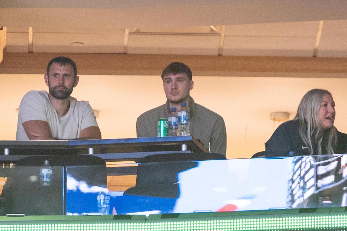 Dallas Mavericks first round pick Cooper Flagg, middle, sits in his suite during the second half of the WNBA game between the Dallas Wings and Indiana Fever at the American Airlines Center in Dallas on Friday, June 27, 2025.