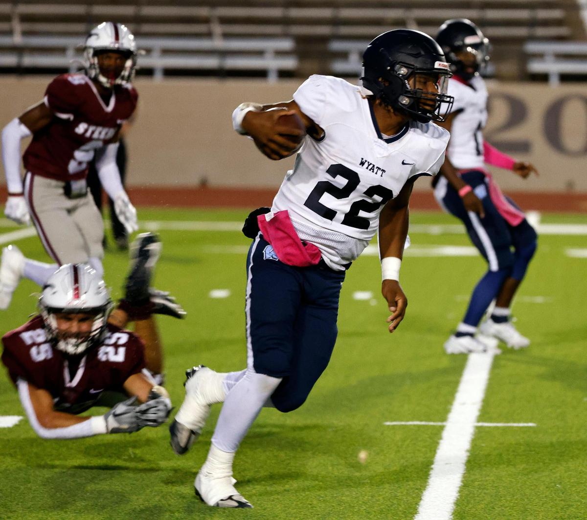 Wyatt wide receiver Jorvorskie Lane (22) brings the ball downfield in the first half of a UIL football game at Farrington Field in Fort Worth, Texas, Friday, Oct. 06, 2023.