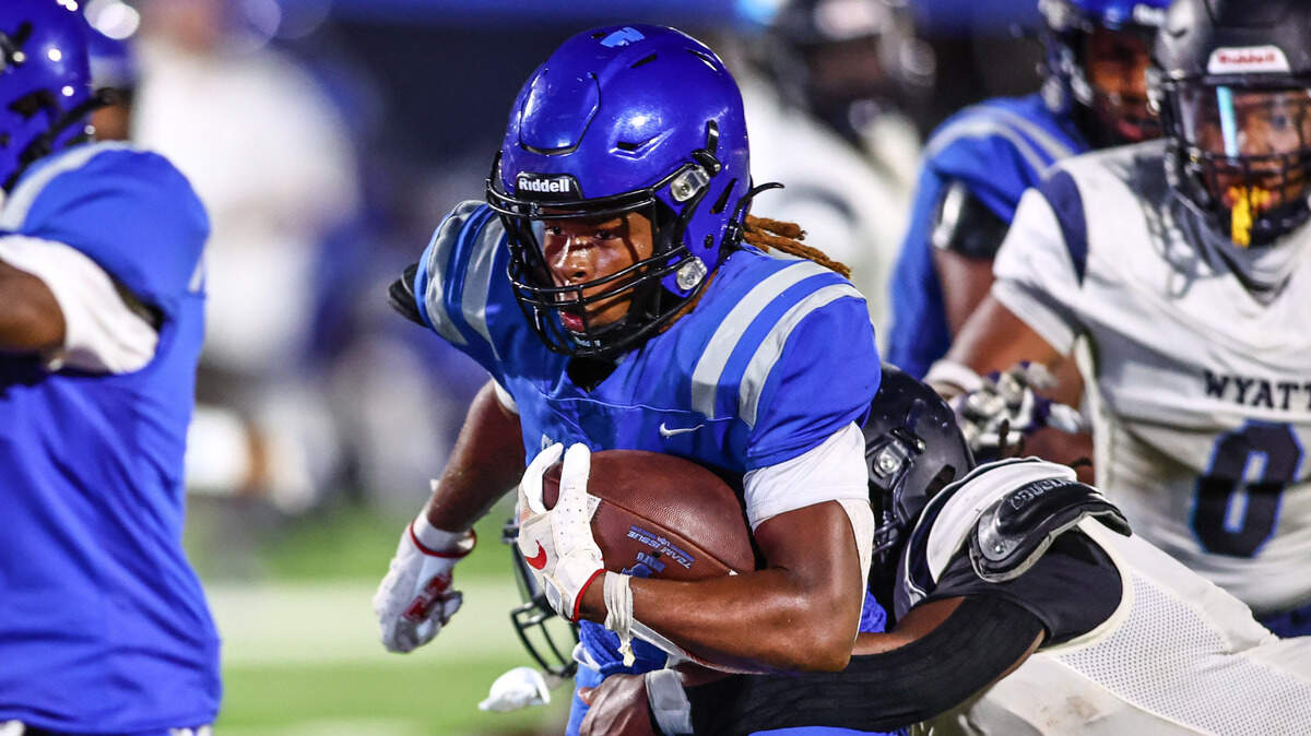 Dunbar running back JaMarion Garrett scores on an eight-yard run late in the first half against Wyatt on Thursday, September 5, 2024 at Clark Stadium in Fort Worth. Garrett had 179 rushing yards in the game and scored the winning two-point conversion.