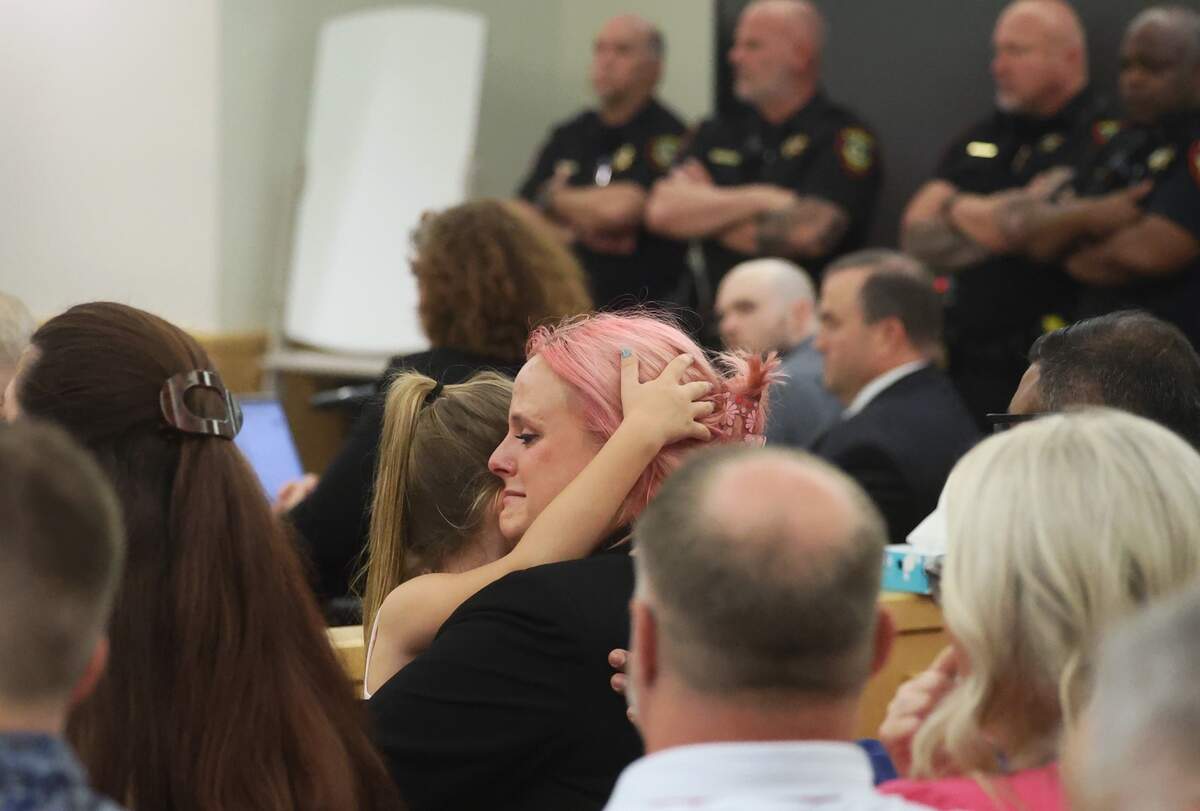 Athena Strand’s mother, Maitlyn Gandy, is hugged by a child after the death penalty verdict is announced for Tanner Horner for the capital murder of 7-year-old Athena.