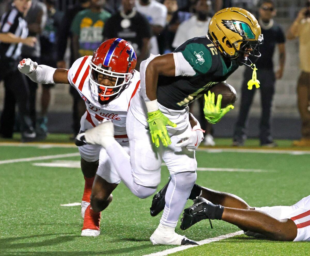DeSoto running back SaRod Baker (12) almost breaks free during a District 11 6A football game at Eagle Stadium in DeSoto, Texas, Friday, Oct. 11, 2024.