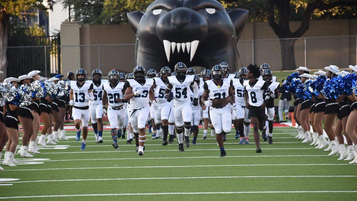 North Crowley Panthers, rushing into the game, against the Fort Worth Paschal Panthers, at Farrington Field in Fort Worth, Texas, Friday, Sep 16, 2022. North Crowley won 54-0. (Sofia Oo/Special to the Star Telegram)
