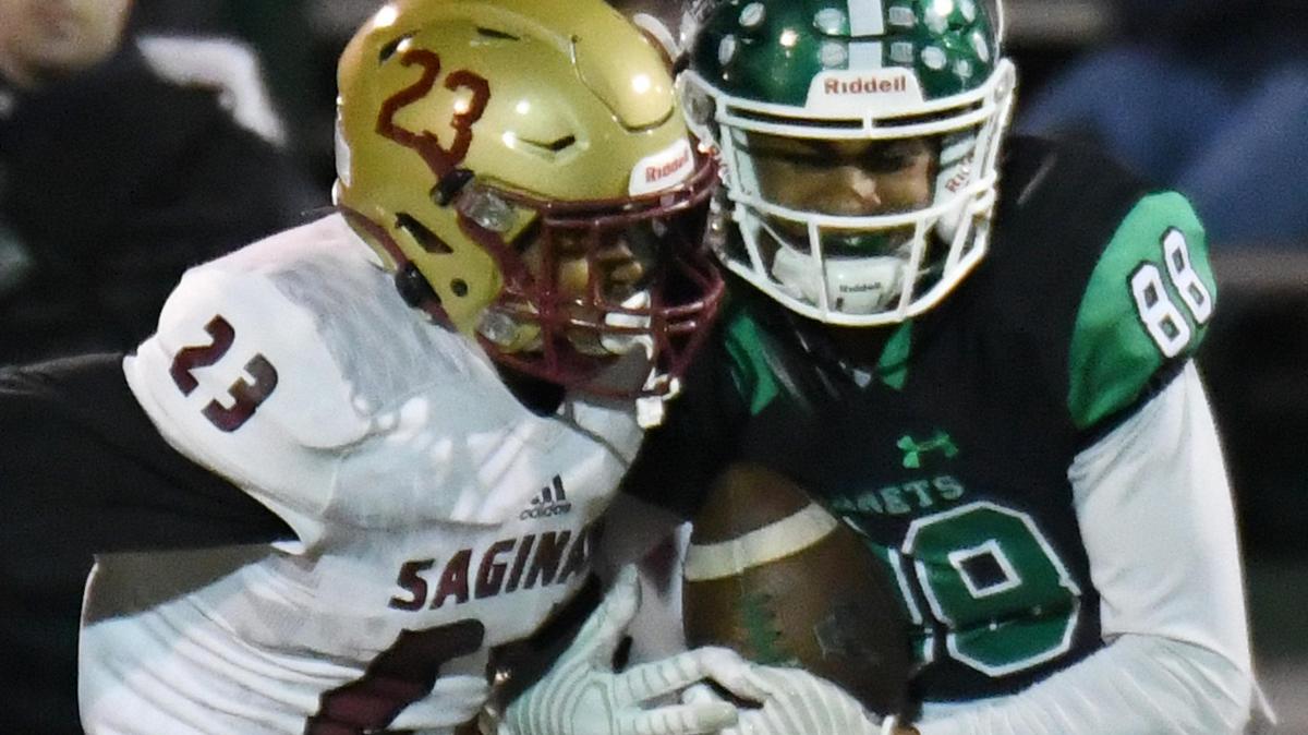 Saginaw’s Sean Verdun, left, tries to defend as Azle receiver Eric McAlister runs in for a touchdown and a 36-0 lead in the second quarter during Friday’s November 1, 2019 football game at Hornet Stadium in Azle, Texas.