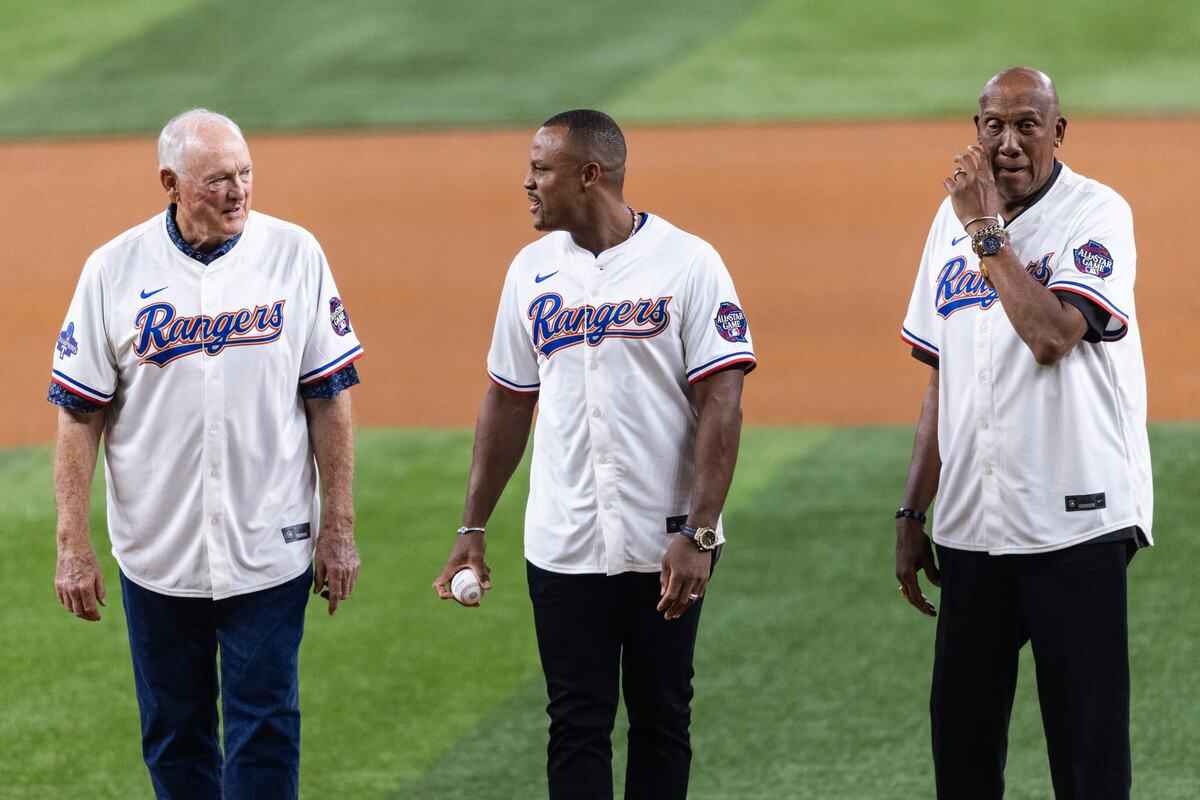 MLB legends Nolan Ryan and Fergie Jenkins watch as Adrian Beltre throws the ceremonial first pitch prior to the 2024 MLB All Star Game at Globe Life Field in Arlington on Tuesday July 16, 2024.