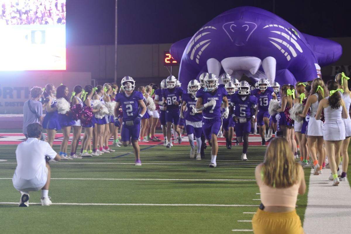 Fort Worth Paschal runs onto the field before facing Fort Worth O.D. Wyatt on Thursday.