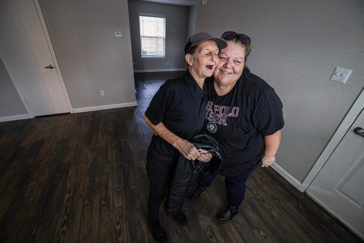 Carol, left, and Amber Rogers react after seeing their new apartment in Saginaw on Tuesday, Nov. 21, 2023. For about four years, Carol and her daughter-in-law Amber have been living in low-cost hotels, motels and even storage units. With the help of the nonprofit organization Community Link, the Rogers were able to move into an apartment just before Thanksgiving.