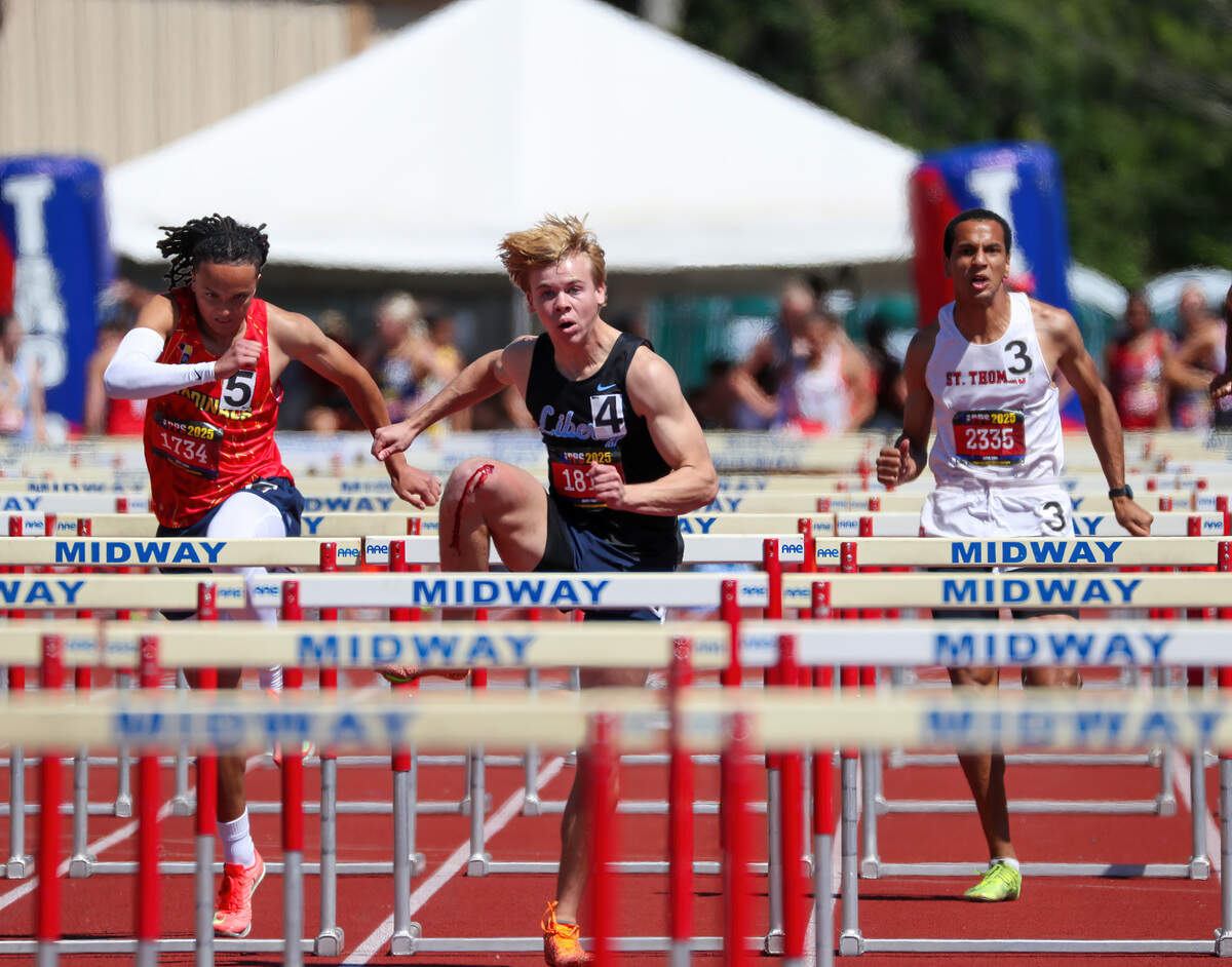Argyle Liberty Christian’s Ewan Curtis clears a hurdle on his way to winning the Class 6A 110 meter hurdles at the TAPPS State Track Meet on Saturday, May 3, 2025 at Waco Midway’s Panther Stadium in Hewitt, Texas.