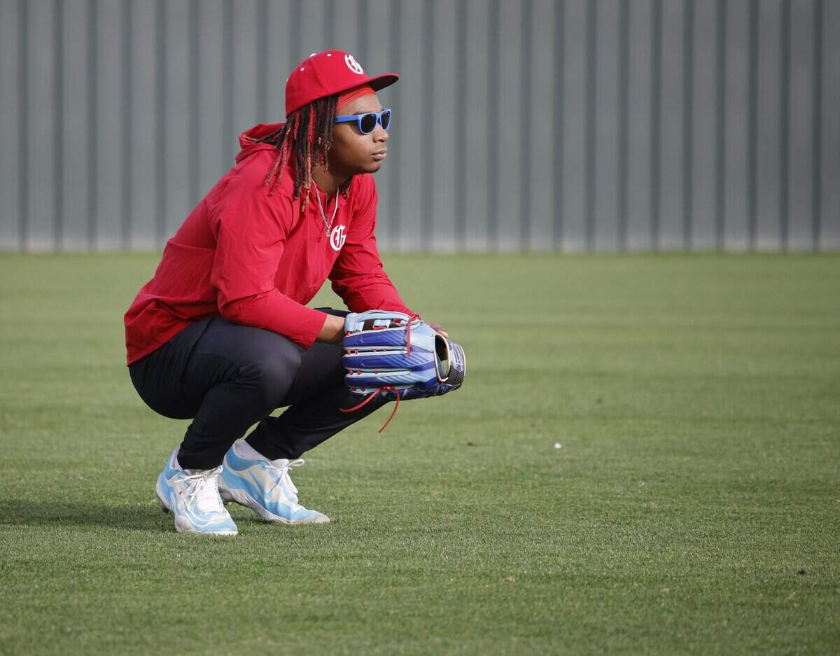 Jorvorskie Lane Jr. relaxes in the outfield during Grapevine Mustang baseball practice at Grapevine High School in Grapevine, Texas, Tuesday, Feb. 17, 2026.