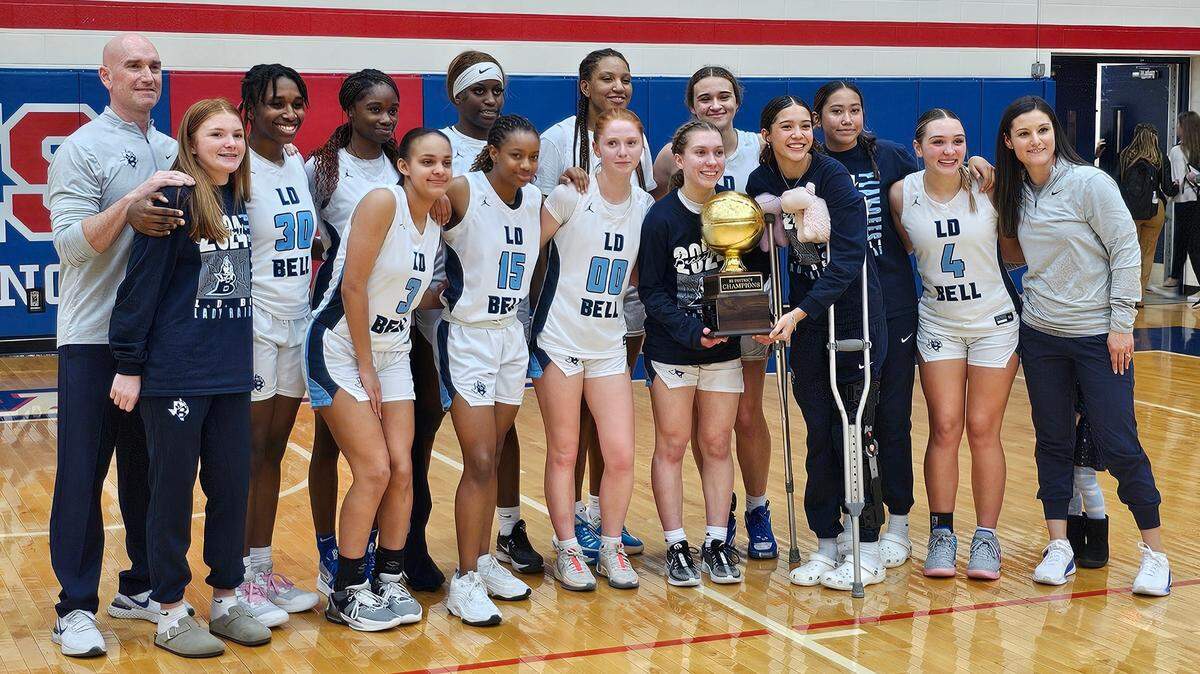The L.D. Bell girls basketball team poses after defeating Keller Fossil Ridge 45-43 in a Class 6A bi-district game on Monday, February 12, 2024 at Grapevine High School in Grapevine, Texas.
