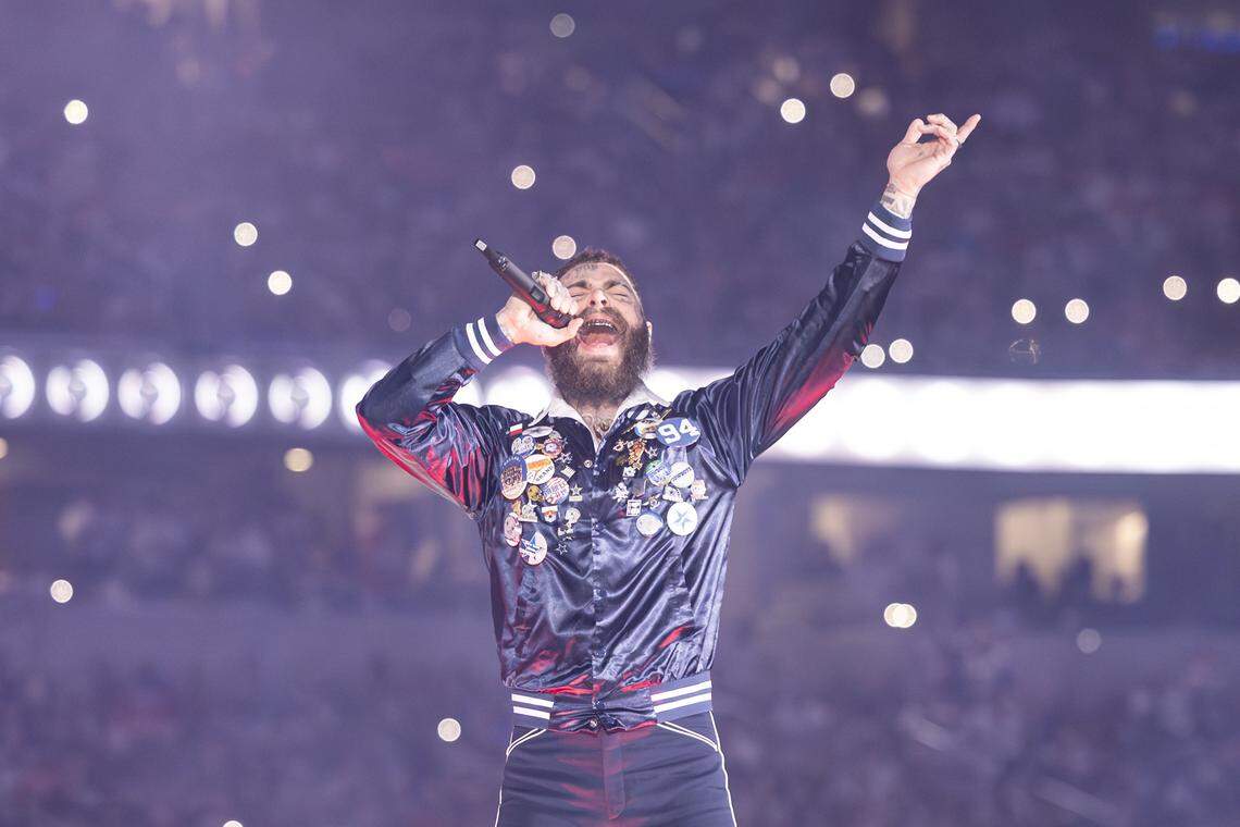Post Malone performs for the halftime show of the Thanksgiving NFL game between the Dallas Cowboys and the Kansas City Chiefs at AT&T Stadium in Arlington on Thursday, Nov. 27, 2025.
