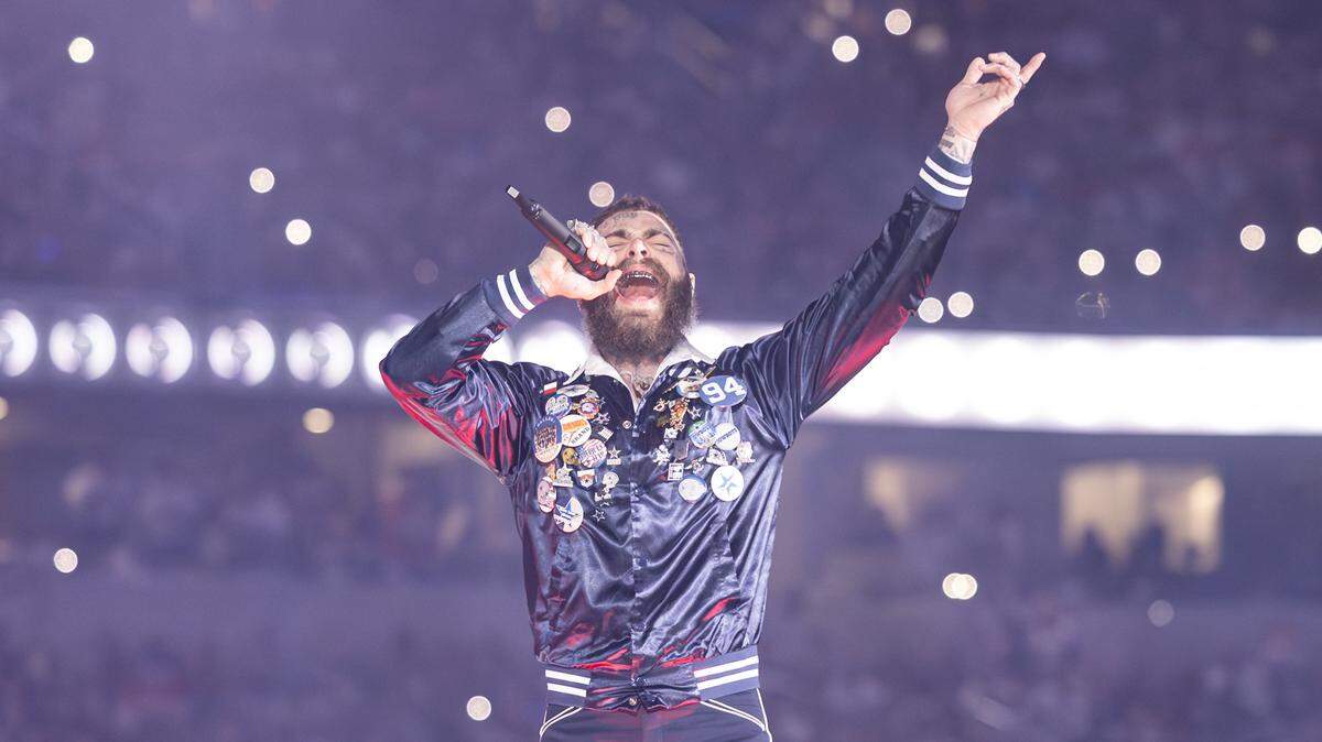 Post Malone performs for the halftime show of the Thanksgiving NFL game between the Dallas Cowboys and the Kansas City Chiefs at AT&T Stadium in Arlington on Thursday, Nov. 27, 2025.