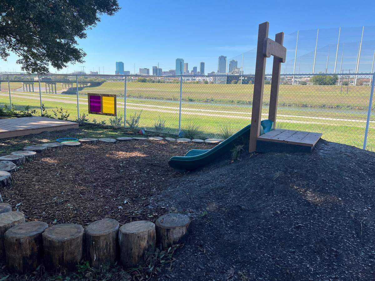 A slide at the Child Care Studio at Riverside’s natural playground for toddlers is pictured during the center’s grand opening event on Nov. 12, 2024. The playground also includes a sand box, an interactive water station and a mulch box for young children.