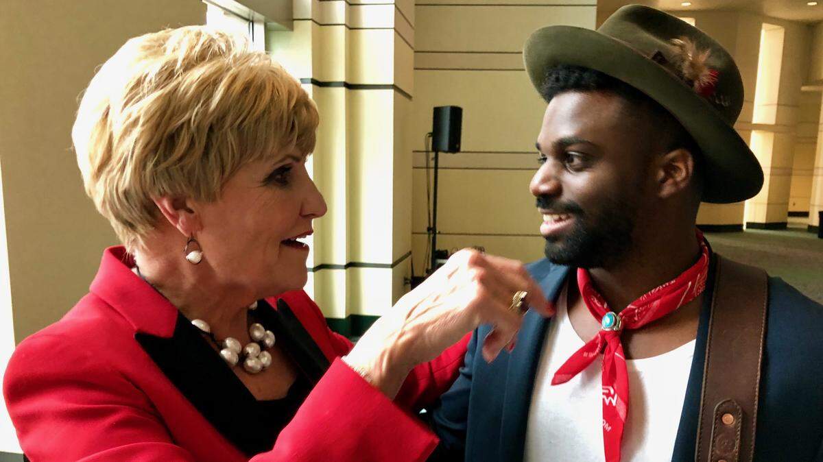 Mayor Betsy Price thanks singer Abraham Alexander of Fort Worth after his performance in the lobby at her State of the City speech.