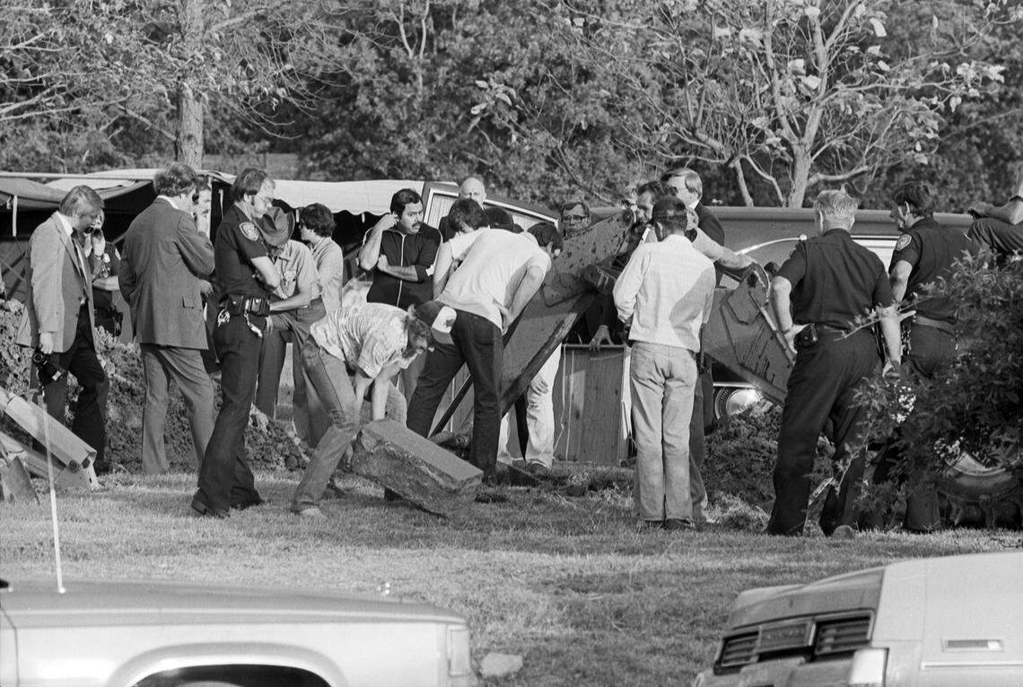 Oct. 4, 1981: A crowd of people, some with shovels, are seen attending the exhumation of Lee Harvey Oswald at Rose Hill Memorial Park in Fort Worth, Texas.