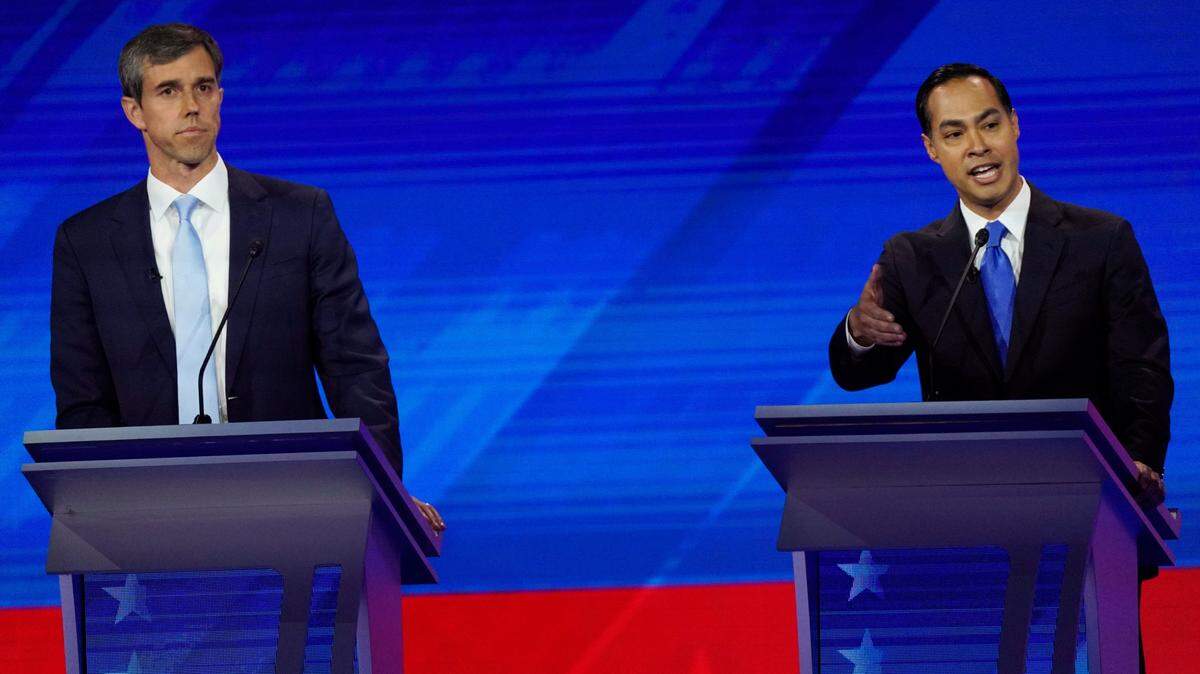 Former Texas Rep. Beto O’Rourke, left, listens as former Housing and Urban Development Secretary Julian Castro, right, responds to a question Thursday, Sept. 12, 2019, during a Democratic presidential primary debate hosted by ABC at Texas Southern University in Houston. (AP Photo/David J. Phillip)