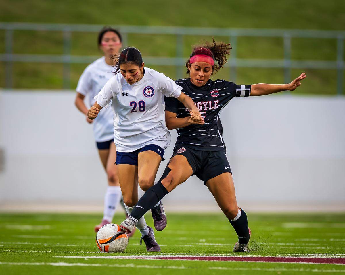 Grapevine’s Paola Granados (28) fights for the ball against Argyle in the Class 5A Division 2 Region 1 Final soccer match on Tuesday, March 31, 2026, at Northwest ISD Stadium in Justin, Texas.