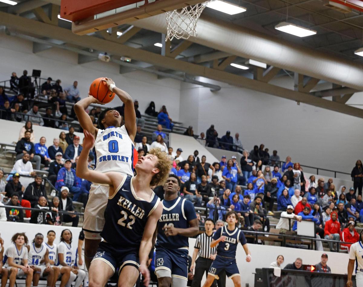 North Crowley guard Benn Jones (0) goes up for two during the second half of the UIL 6A Region I Bi-District playoff game at Martin High School in Arlington, Texas, Monday, Feb. 17, 2025.